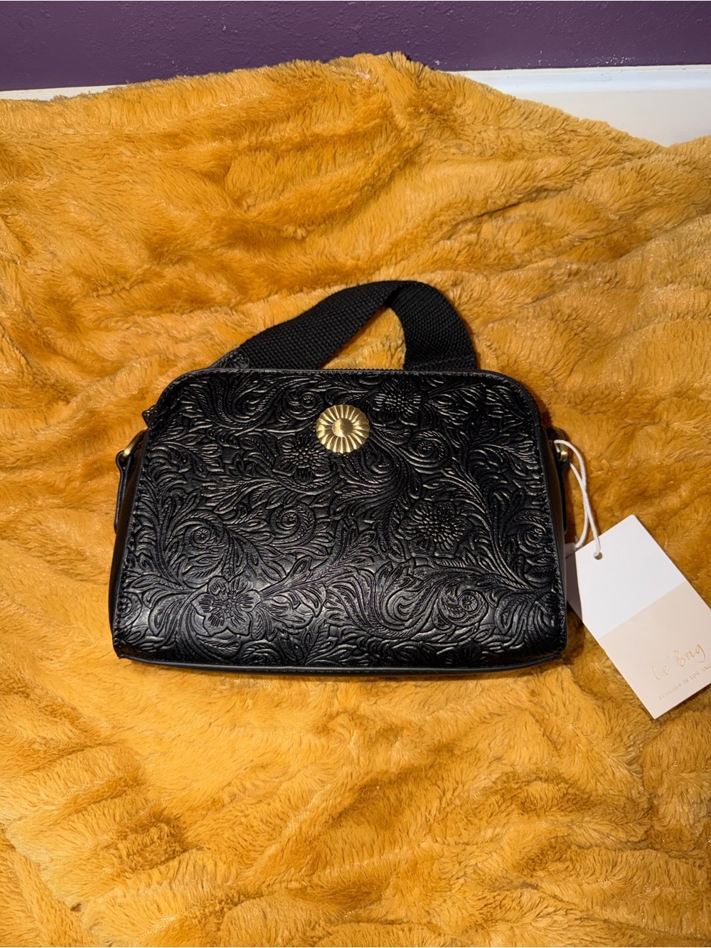 Embossed Black Floral Crossbody Bag with Gold Accent